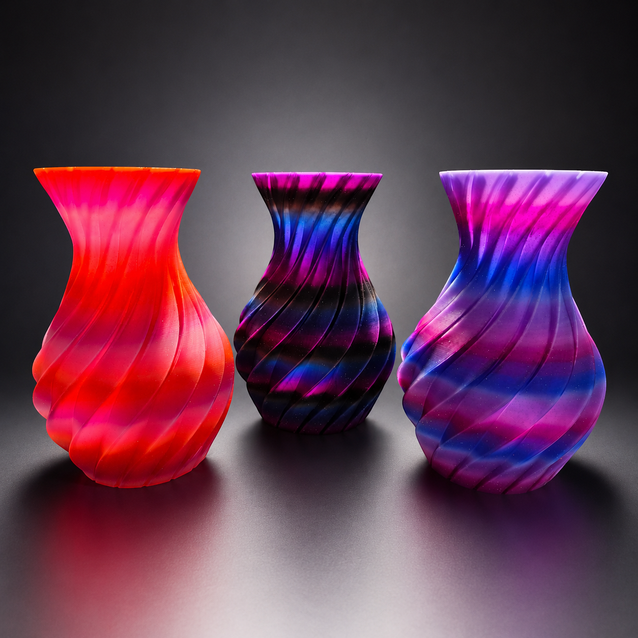 JT-PRINT-SERVICE Twisting Pillars Vases in Sunset, Dark Galaxy, and Nebula gradient PLA with spiral ribbed texture.